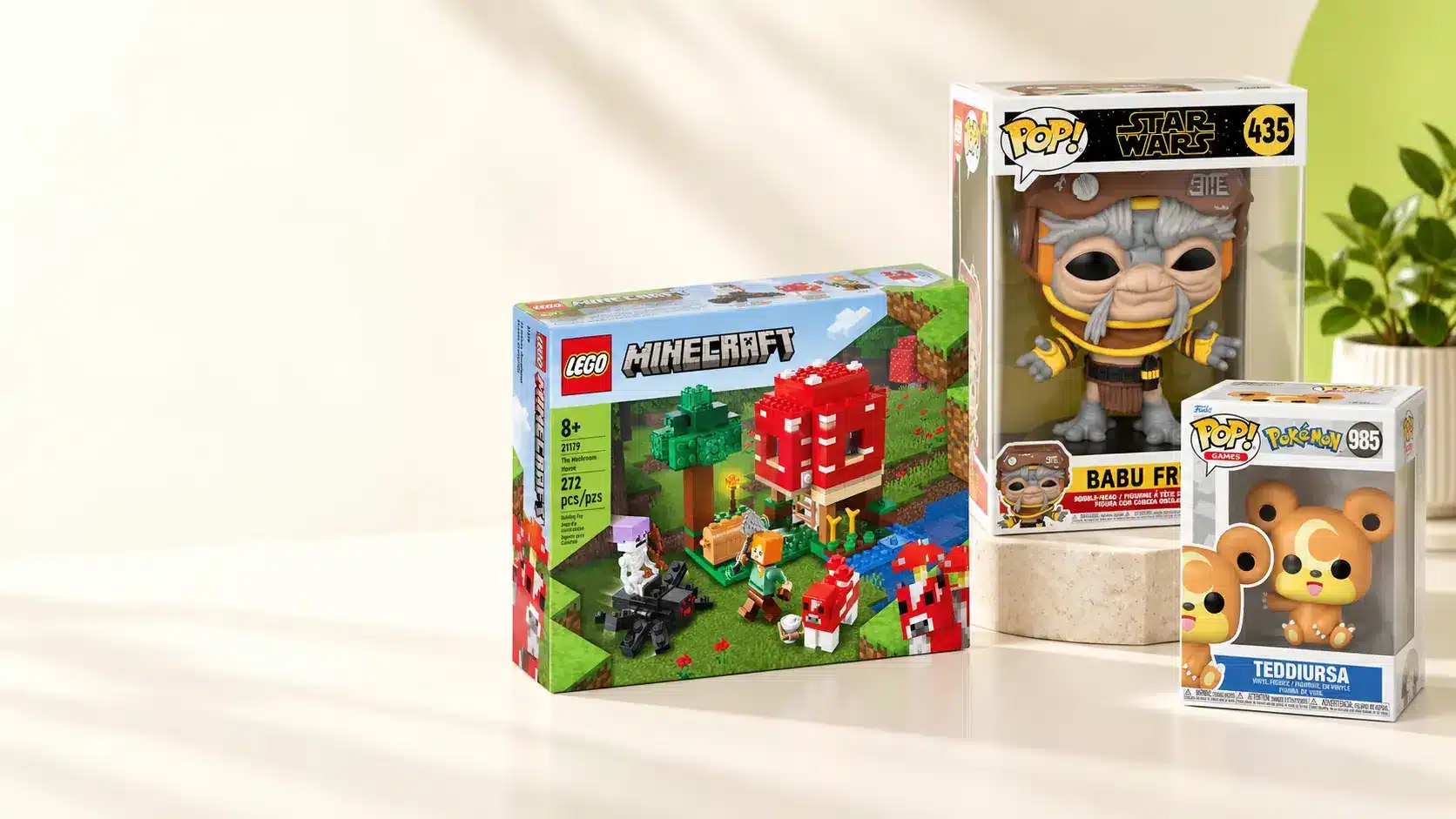 LEGO Minecraft set, Funko POP figures and Pokemon Teddiursa styled on a bright studio shelf